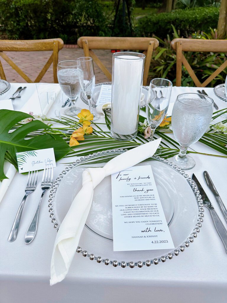 A table set with plates, silverware and napkins.