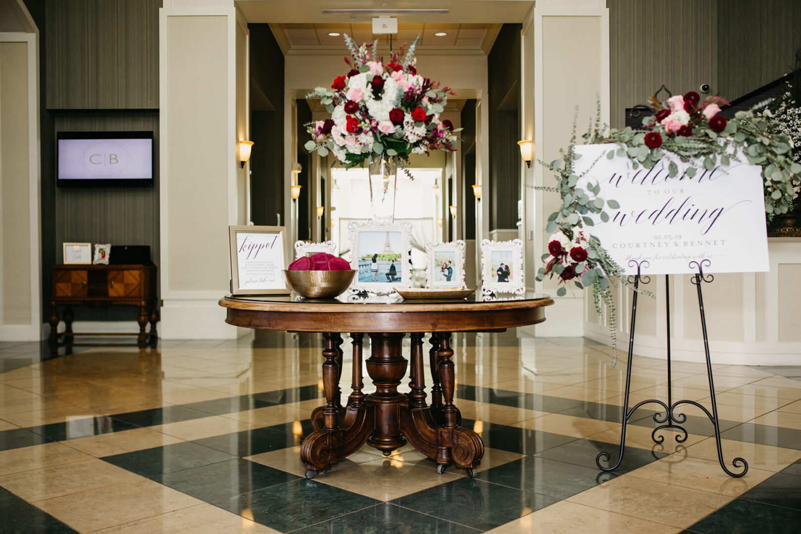 A round table in the center of a lobby.