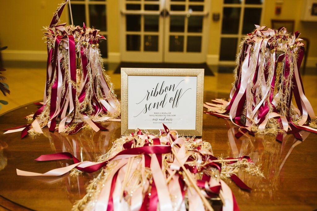 A table with ribbons tied around the top of it.