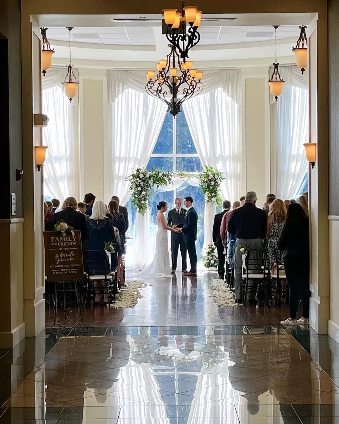 A wedding ceremony in the hall of a hotel.